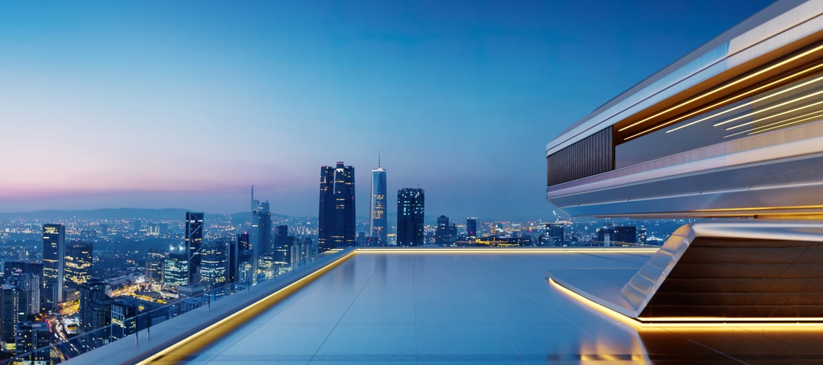 Modern rooftop lounge with stunning cityscape view during sunset, offering luxurious and futuristic ambiance
